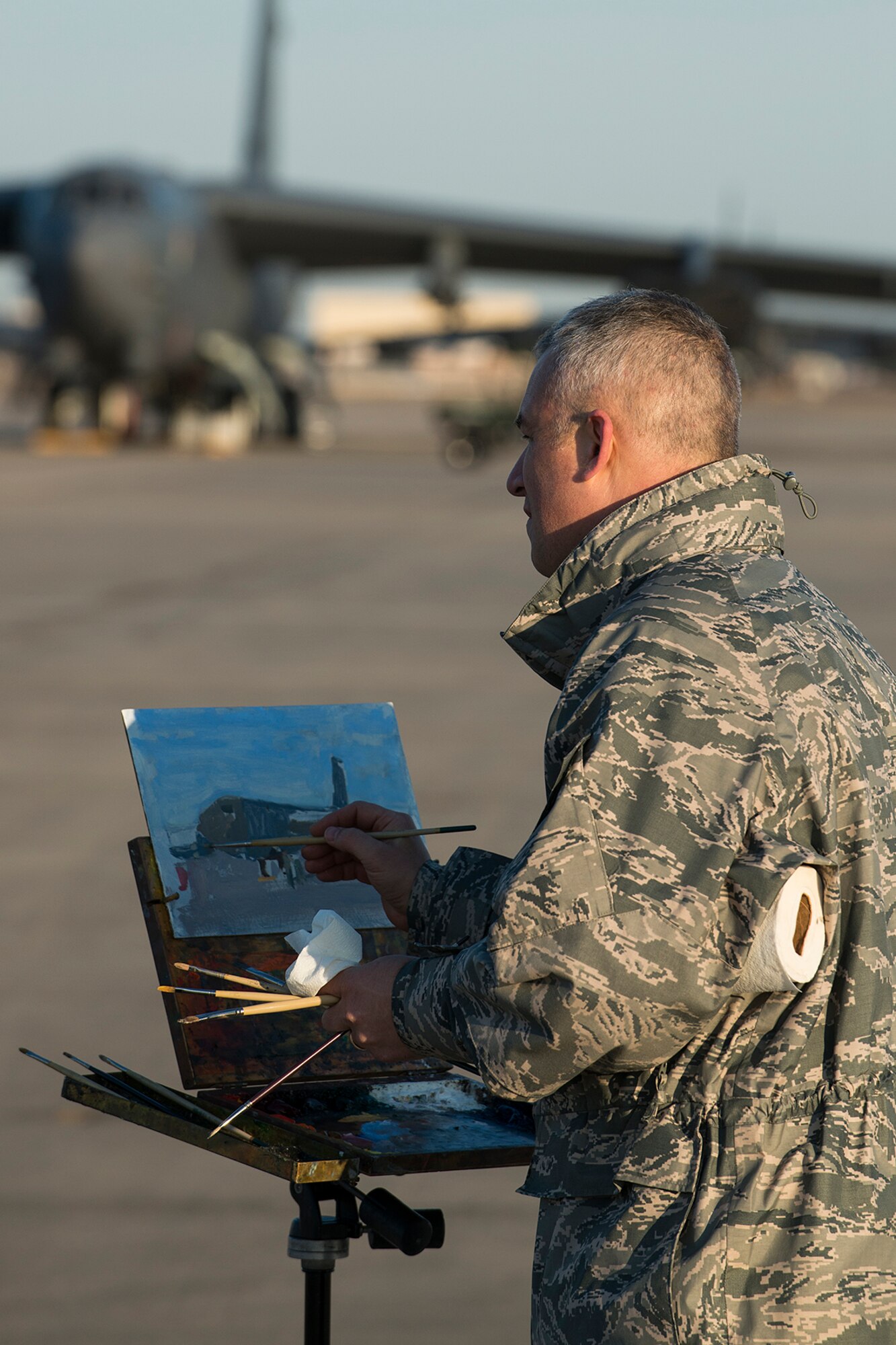 U.S. Air Force Maj. Warren Neary does a rough painting of a 307th Bomb Wing B-52H Stratofortress during his visit on Nov. 2, 2014, Barksdale Air Force Base, La. Neary is a painter for the Air Force Art Program and has completed over 20 paintings documenting the role and diverse capabilities of the Unites States Air Force. (U.S. Air Force photo by Master Sgt. Greg Steele/Released)