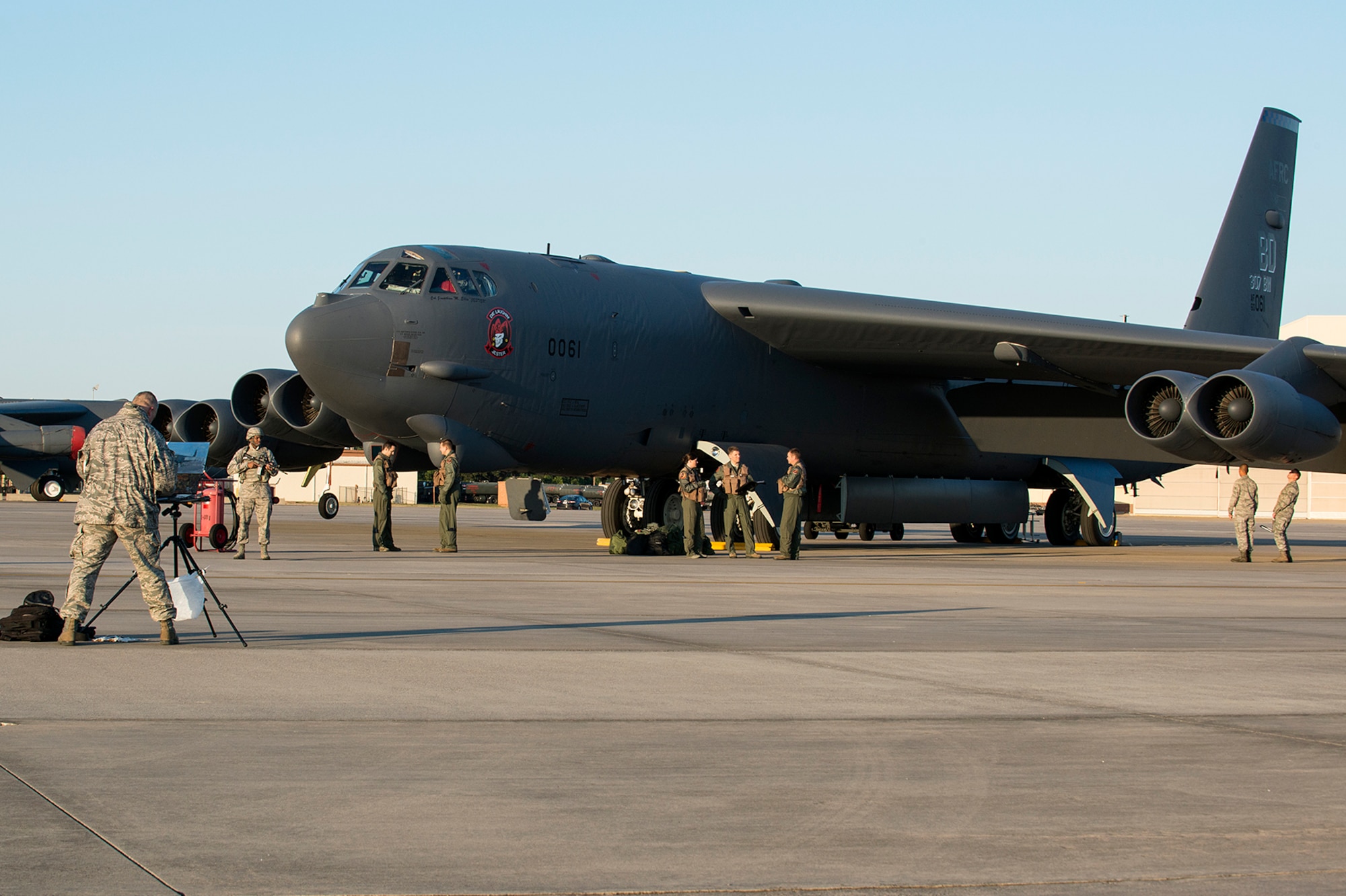 Members of the 307th Bomb Wing pose for a painting on Nov. 2, 2014, Barksdale Air Force Base, La. The wing was selected for the painting by the Air Force Art Program, which documents the role and diverse capabilities of the Unites States Air Force. (U.S. Air Force photo by Master Sgt. Greg Steele/Released)