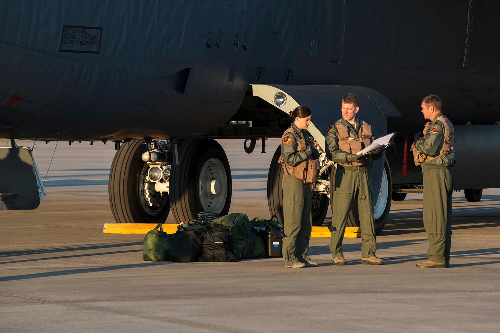 Members of the 343rd Bomb Squadron pose for a painting as part of the Air Force Art Program, Nov. 2, 2014, Barksdale Air Force Base, La. The program documents the story of the Air Force through the universal language of art and exposes the military and the public to the role and diverse capabilities of the Air Force. (U.S Air Force photo by Master Sgt. Greg Steele/Released)