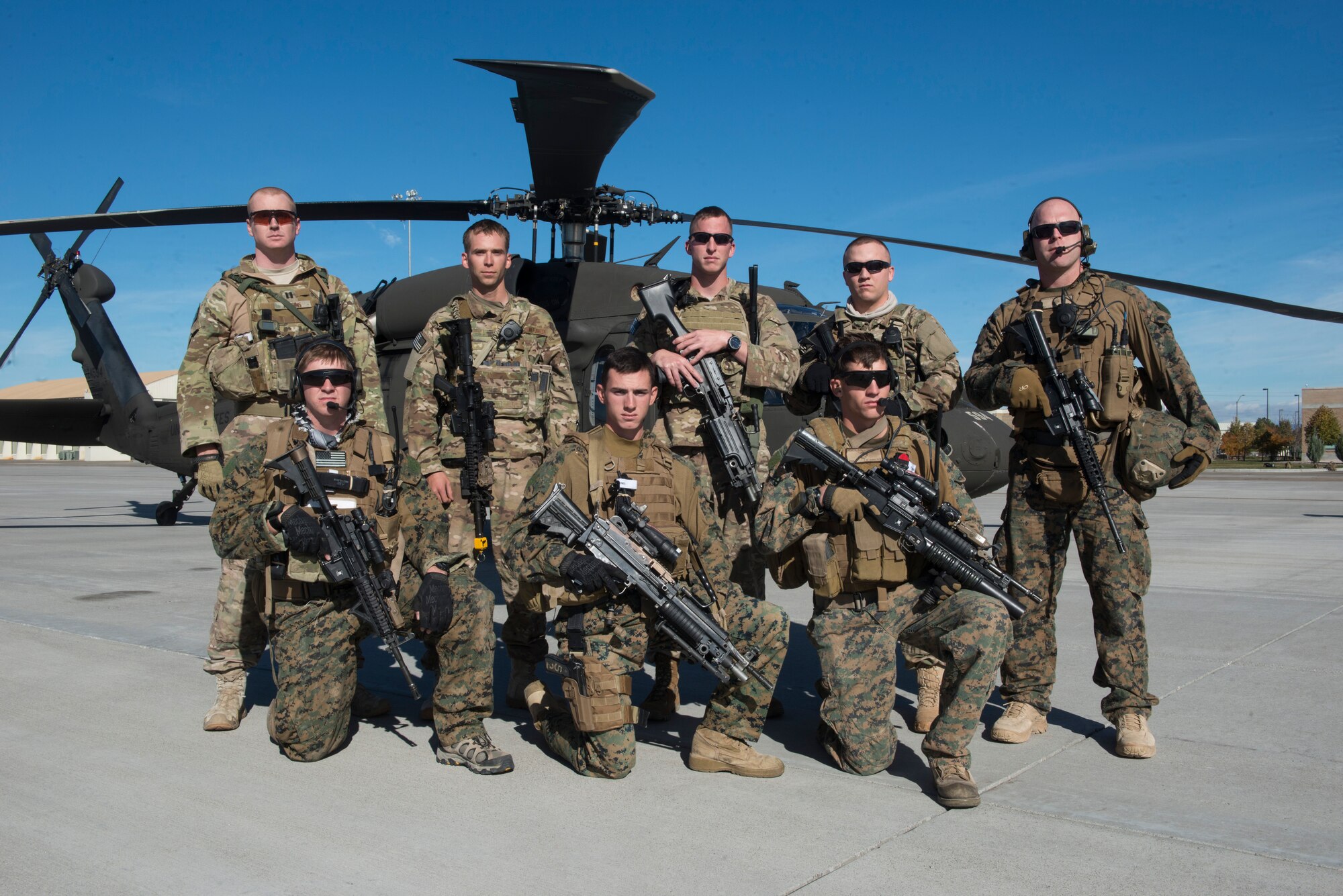 366th Security Forces Squadron members  and 1st Air Naval Gunfire Liaison Company joint terminal attack controllers pose in front of a UH-60 Blackhawk during the Capstone Training Event at Mountain Home Air Force Base, Idaho, Nov. 5, 2014. The joint-force training provided real world simulations for the Airmen and Marines. (U.S. Air Force photo by Airman Connor J. Marth/RELEASED)