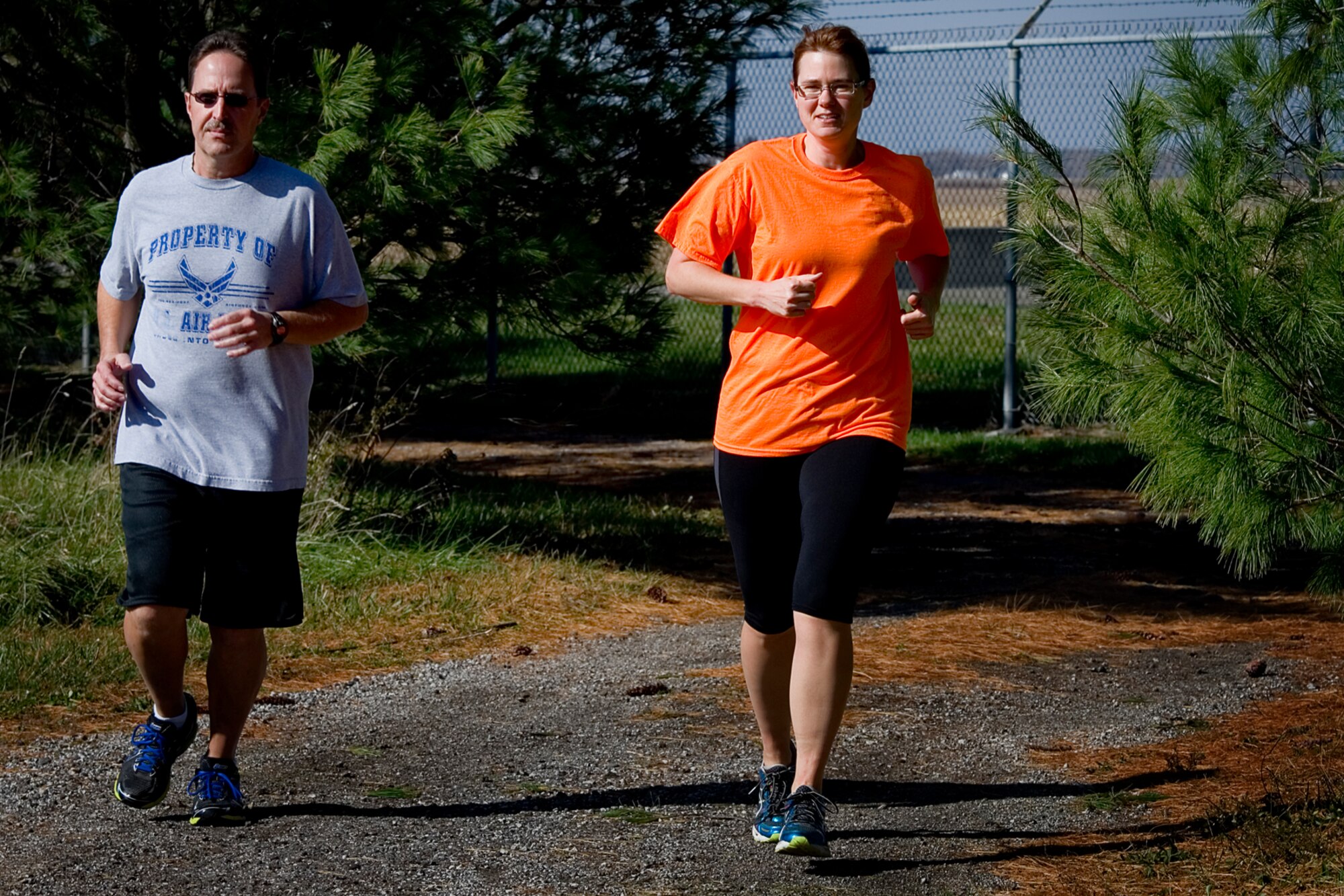 Jeff and Cathy Castleberry, 434th Air Refueling Wing members, run along the jogging path during a 10K race at Grissom Air Reserve Base, Ind., Nov. 5, 2014. Grissom routinely holds runs and events to promote camaraderie, esprit de corps and physical fitness. (U.S. Air Force photo/Tech. Sgt. Douglas Hays)