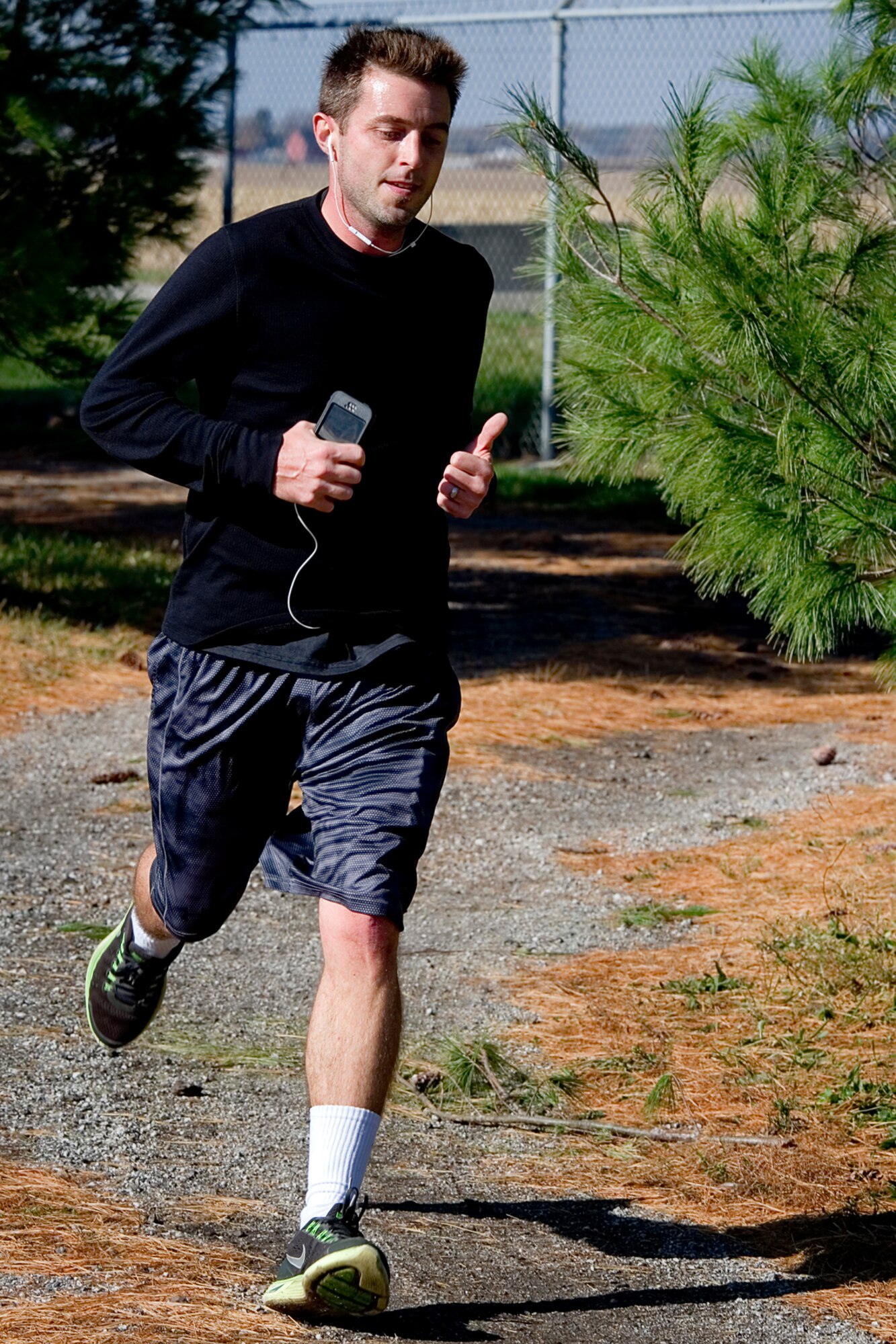 Brian Wright, 434th Air Refueling Wing combat readiness technician, rounds the corner during a 10K at Grissom Air Reserve Base, Ind., Nov. 5, 2014. Grissom routinely holds runs and events to promote esprit de corps and physical fitness. (U.S. Air Force photo/Tech. Sgt. Douglas Hays)