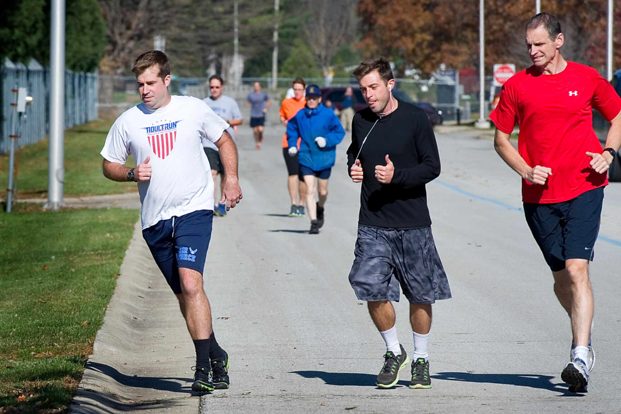 Runners take off at the start of a 10K veteran?s race at Grissom Air Reserve Base, Ind., Nov. 5, 2014. Grissom routinely holds runs and events to promote camaraderie, esprit de corps, and physical fitness. (U.S. Air Force photo/Tech. Sgt. Douglas Hays)