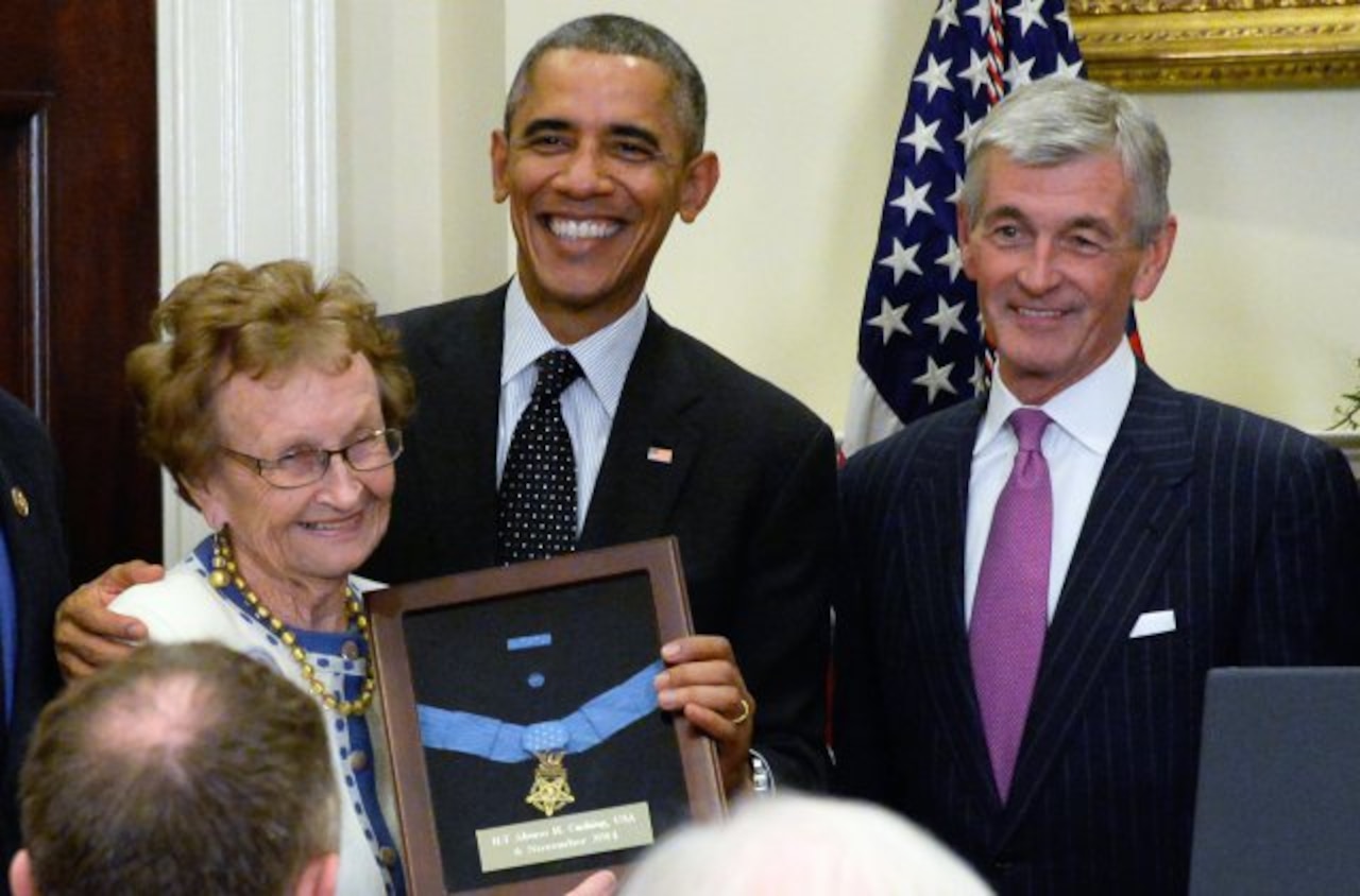 President Barack Obama awards the Medal of Honor to 1st Lt. Alonzo H. Cushing for his gallantry during combat at Gettysburg July 3, 1863. Receiving the medal at the White House ceremony, Nov. 6, 2014, is Helen Loring Ensign, Cushing's first cousin, twice removed. Some 24 other descendants were present as well. Army Secretary John M. McHugh is beside the president. U.S. Army photo by Staff Sgt. Laura Buchta