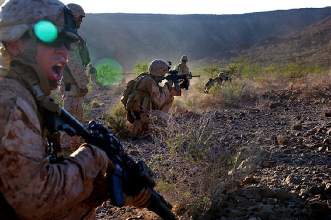 U.S. Marines maneuver during a live-fire exercise at D’Arta Plage, Djibouti, Nov. 3, 2014. 