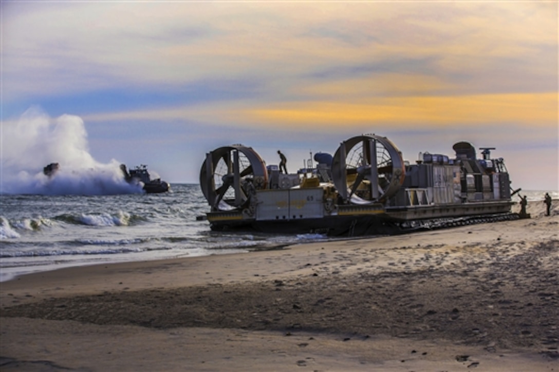 Marines disembark a landing craft air cushion vehicle during the multinational exercise Bold Alligator 2014 on Camp Le Jeune, N.C., Nov. 4, 2014.