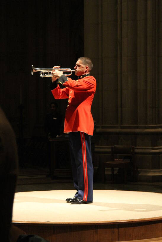 On Nov. 7, 2014, the Marine Chamber Orchestra and the Washington National Cathedral Choir performed a concert titled “Letters from War: A Tribute to Veterans” at the Washington National Cathedral. In addition to works such as John Williams’ Liberty Fanfare, The Lord is my Shepherd by John Rutter, and the Battle Hymn of the Republic, the moving tribute also included readings from letters sent from the font lines during the major conflicts of the past 100 years. Pictured, Master Gunnery Sgt. Kurt Dupuis sounding "Taps." (U.S. Marine Corps photo by Gunnery Sgt. Amanda Simmons/released)