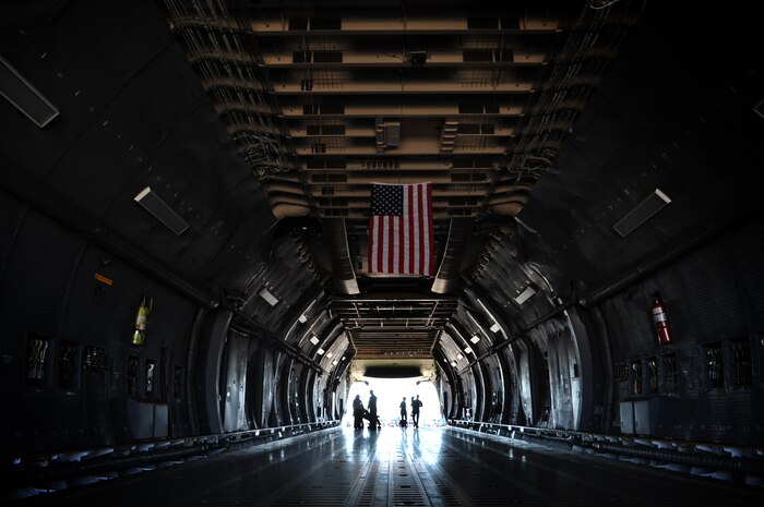 Visitors to the Nellis Open House walk through the cargo section of a C-5 Galaxy Nov. 7, 2014, at Nellis Air Force Base, Nev. The C-5 has the distinctive high T-tail, 25-degree wing sweep, and four turbofan engines mounted on pylons beneath the wings. (U.S. Air Force photo by Senior Master Sgt. Cecilio Ricardo)