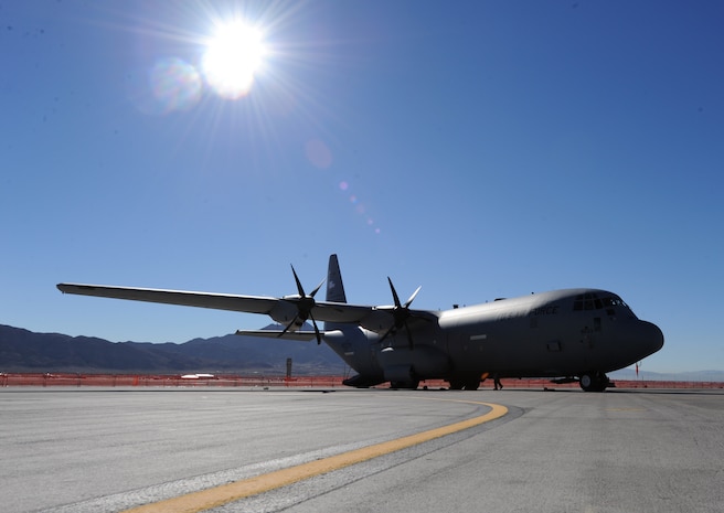 A C-130J Hercules sits as a static display during the Nellis Open House, Nov. 7, 2014, at Nellis Air Force Base, Nev. Using its aft loading ramp and door, the C-130 can accommodate a wide variety of oversized cargo, including everything from utility helicopters and six-wheeled armored vehicles to standard palletized cargo and military personnel. (U.S. Air Force photo by Airman 1st Class Mikaley Towle)
