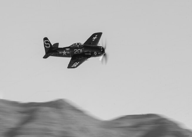 An F8F Bearcat flew as part of the Korean reenactment during the Nellis Open House practice Nov. 7, 2014, at Nellis Air Force Base, Nev. The Bearcat was a single-engine naval fighter aircraft that served into the mid-20th century in the U.S. Navy, U.S. Marine Corps, and the air forces of other nations. (U.S. Air Force photo by Airman 1st Class Thomas Spangler)
