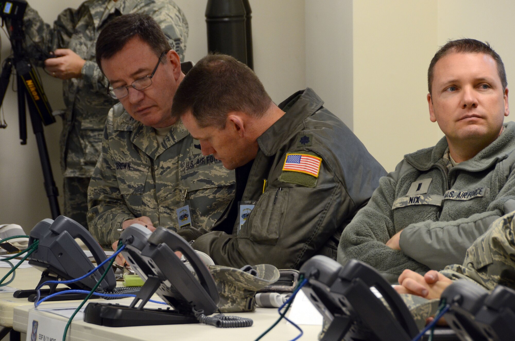 U.S. Air Force Col. Thomas W. Brown, Jr., 145th Airlift Wing, Air Operations Officer, Lt. Col. Miles K. Harkey, commander, 145th Operations Support Squadron and 1st Lt. Michael V. Nix, 145th Maintenance Squadron, all members of the Wing Inspection Team (WIT), review the Master Scenario Event List (MSEL) prior to the Anti-Terrorism Exercise held Nov. 1, 2014, at the North Carolina Air National Guard Base, Charlotte Douglas Intl. Airport. The annual Anti-Terrorism Exercise simulated a car-bomb detonation inside the perimeter of the air base. The exercise initiated force protection measures across the base and tested the Wing’s ability to respond accordingly. After the car-bomb detonation, Airmen also performed simulated search and recovery procedures. (U.S. Air National Guard photo by Master Sgt. Patricia F. Moran, 145th Public Affairs/Released)