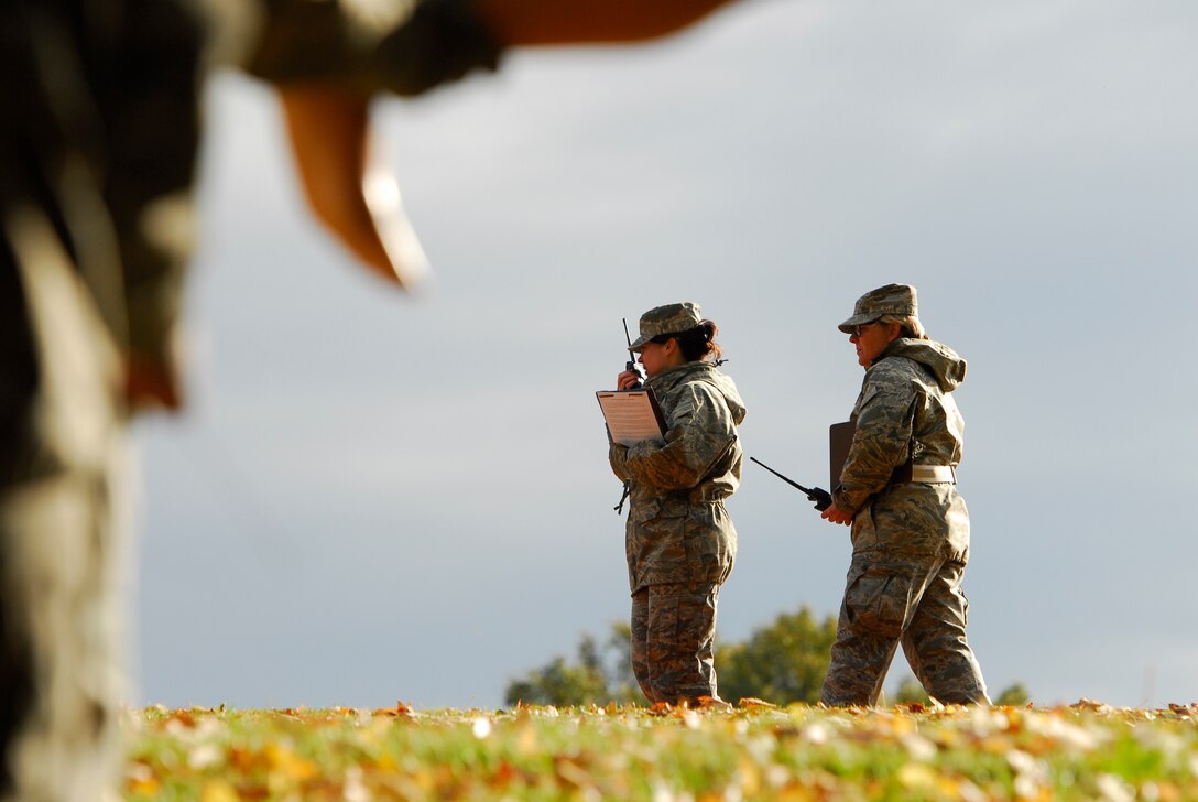 U.S. Air Force Lt. Col. Lisa Kirk (center), commander, 145th Force Support Squadron, relays the exercise conclusion radio call to members of the search and recovery team during an annual Anti-Terrorism Exercise simulating a car-bomb detonation inside the perimeter of the North Carolina Air National Guard Base, Charlotte Douglas Intl. Airport, Nov. 1, 2014. The exercise initiated force protection measures across the base, testing the Wing’s ability to respond accordingly. After the car-bomb detonation, Airmen also performed simulated recovery procedures until conclusion of the exercise. (U.S. Air National Guard photo by Staff Sgt. Julianne M. Showalter, 145th Public Affairs/Released)