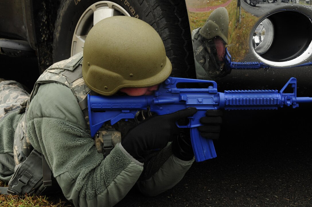 U.S. Air Force Airman 1st Class Kamil Konarski, 145th Security Forces Squadron, actively participates in the 145th Airlift Wing’s annual Anti-Terrorism Exercise simulating a car bomb detonation inside the perimeter of the North Carolina Air National Guard Base, Charlotte Douglas Intl. Airport, Nov. 1, 2014. The exercise initiated force protection measures across the base and tested the Wing’s ability to respond accordingly. After the car-bomb detonation, airmen also performed simulated recovery procedures until conclusion of the exercise. (U.S. Air National Guard photo by Senior Airman Laura J. Montgomery, 145th Public Affairs/Released)