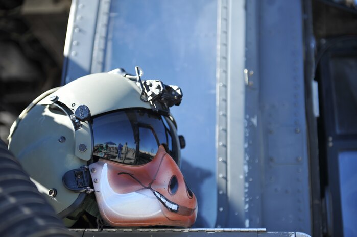 An HH-60G Pave Hawk aircrew member’s helmet rests on the helicopter while on static display at the Nellis Open House Nov. 7, 2014, at Nellis Air Force Base, Nev. The primary mission of the HH-60G Pave Hawk helicopter is to conduct day or night personnel recovery operations into hostile environments to recover isolated personnel during war. (U.S. Air Force photo by Tech. Sgt. Sanjay Allen)