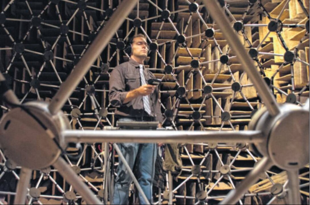 Dr. Griffin Romigh tests 3-D audio software that spatially separates sound cues to mimic real-life human audio capabilities, Nov. 7, 2014 at Wright-Patterson Air Force Base, Ohio. The application allows operators in complex communication environments with multiple talking voices to significantly improve voice intelligibility and communication effectiveness. The technology, which consists primarily of software and stereo headphones, has potential low-cost, high-value application for both aviation and ground command and control communication systems. Romigh is a researcher at the Air Force Research Laboratory’s Human Effectiveness directorate, Battlespace Acoustics Branch.  (Air Force photo/Richard Eldridge)