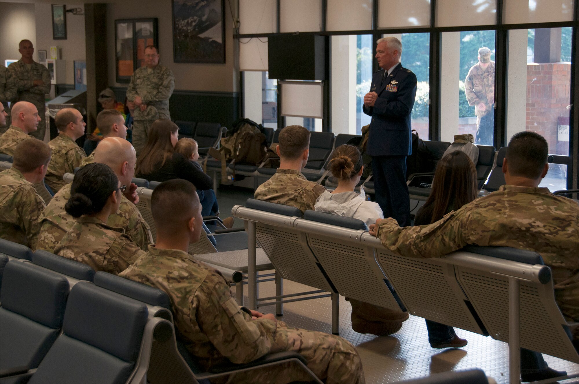 MCCHORD FIELD, Wash.-- Col. Scott McLaughlin, 446th Airlift Wing commander, meets with Airmen from the 36th and 86th Aerial Port Squadrons, at the passenger terminal as they prepare to deploy to Dakar, Senegal in West Africa Nov. 8 . Air transportation specialists will be supporting ground personnel for the campaign against Ebola, known as Operation United Assistance. Chief Master Sgt. Christopher Dietz, 86th APS air transportation manager, said the team will most likely be moving passengers, medical equipment, and supplies during the half-year tour. (U.S. Air Force Reserve photo by Staff Sgt. Bryan Hull)