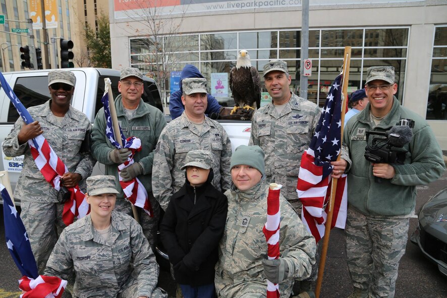 Patriotic American Airmen of the 932nd Airlift Wing from Scott Air Force Base, paid tribute to veterans at the St. Louis 31st annual parade and met the Great American Bald Eagle before the event started.  (U.S. Air Force photo/Maj. Stan Paregien)
