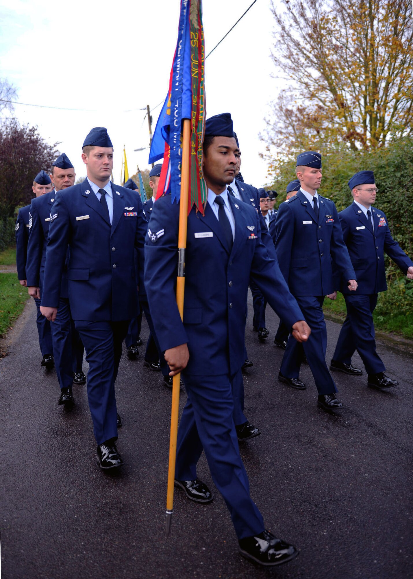 Team Mildenhall Airmen march in a Remembrance Day parade Nov. 9, 2014, at Dickleburgh, England. The parade consisted of members of the Royal British Legion, U.S. Air Force Airmen and several local scout troops. (U.S. Air Force photo by Airman 1st Class Preston Webb/Released)