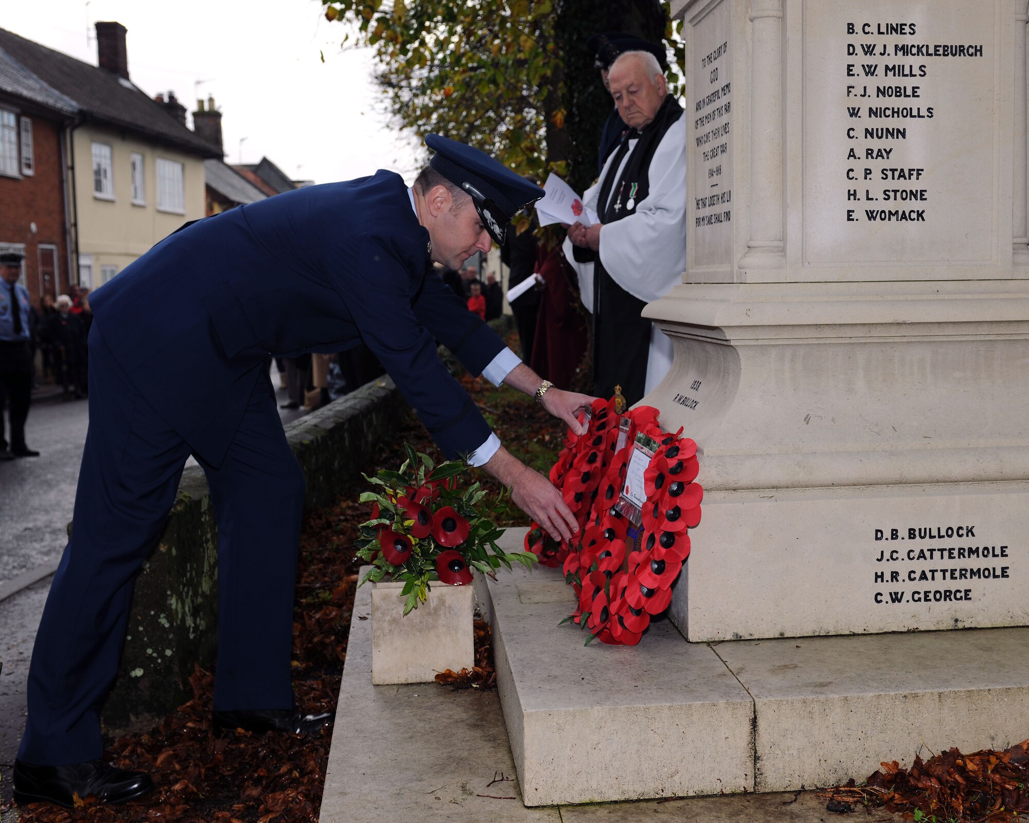 U.S. Air Force Lt. Col. Joel Rivard, 351st Air Refueling Squadron director of operations, places a wreath during a Remembrance Day ceremony Nov. 9, 2014, at Dickleburgh, England. Rivard, along with several Team Mildenhall Airmen, marched in a Remembrance Day parade to honor those fallen Airmen who came before them. (U.S. Air Force photo by Airman 1st Class Preston Webb/Released)