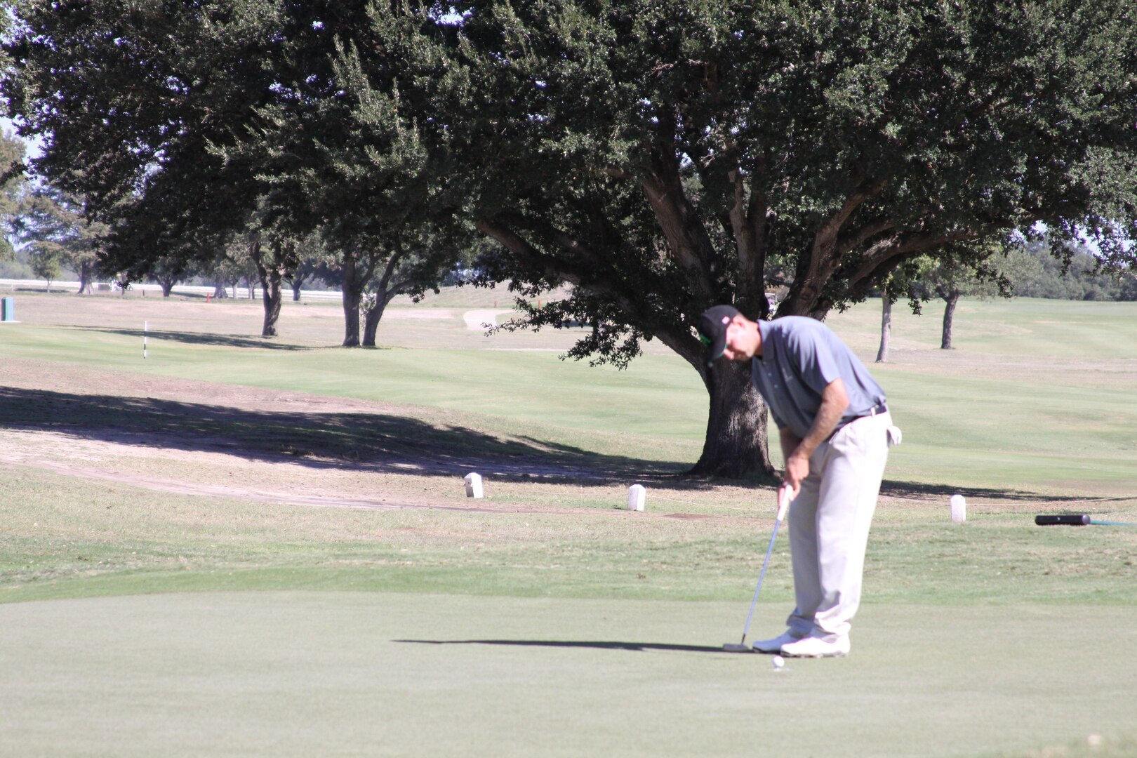 Army Spec. Jordan-Tyler Massey puts during his gold medal performance during the Armed Forces Golf Championship.  Massey led Army to the team gold medal, ending Air Force's ten-year run at top.