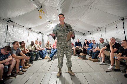 U.S. Air Force Lt. Col. Bruce Bancroft of the Kentucky Air National Guard’s 123rd Contingency Response Group briefs Airmen as they arrive at Léopold Sédar Senghor International Airport in Dakar, Senegal, Nov. 2, 2014. 