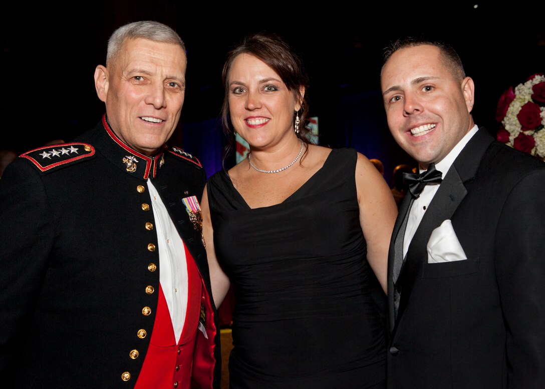 The Assistant Commandant of the Marine Corps, Gen. John M. Paxton, Jr., poses for a photo with guests during the Commandant's Birthday Ball at the Gaylord National Resort and Convention Center, National Harbor, Md., Nov. 8, 2014. (U.S. Marine Corps photo by Cpl. Tia Dufour/Released)