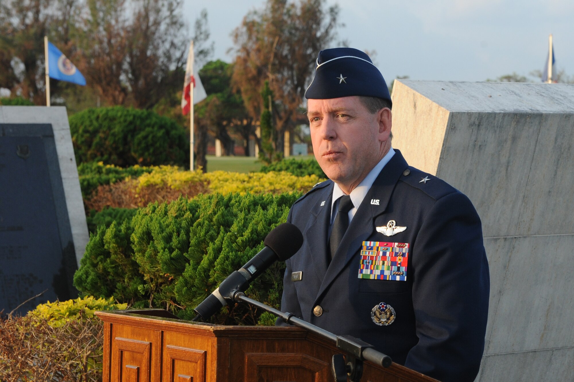 U.S. Air Force Brig. Gen. James B. Hecker, 18th Wing commander, speaks to members of Team Kadena during a Veterans Day ceremony at Kadena Air Base, Japan, Nov. 11, 2014. Hecker spoke about what it means to be the Keystone of the Pacific and how we need to be ready at all times like those who served before us. (U.S. Air Force photo by Airman 1st Class Stephen G. Eigel/Released)