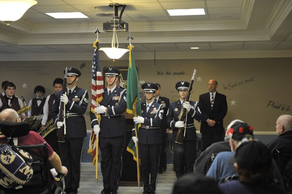 The Washington Air National Guard’s 141st Air Refueling Wing Honor Guard from Fairchild Air Force Base presents the colors Nov. 8, 2014, at the Spokane Veterans Home in Spokane, Wash. The Honor Guard kicked off the event that was conducted for the residents of the veteran’s home where Col. Charles McDaniel, 92nd Air Refueling Wing commander, spoke to more than 60 former Soldiers, Sailors, Marines and Airmen. (U.S. Air Force photo/Airman 1st Class Taylor Bourgeous)