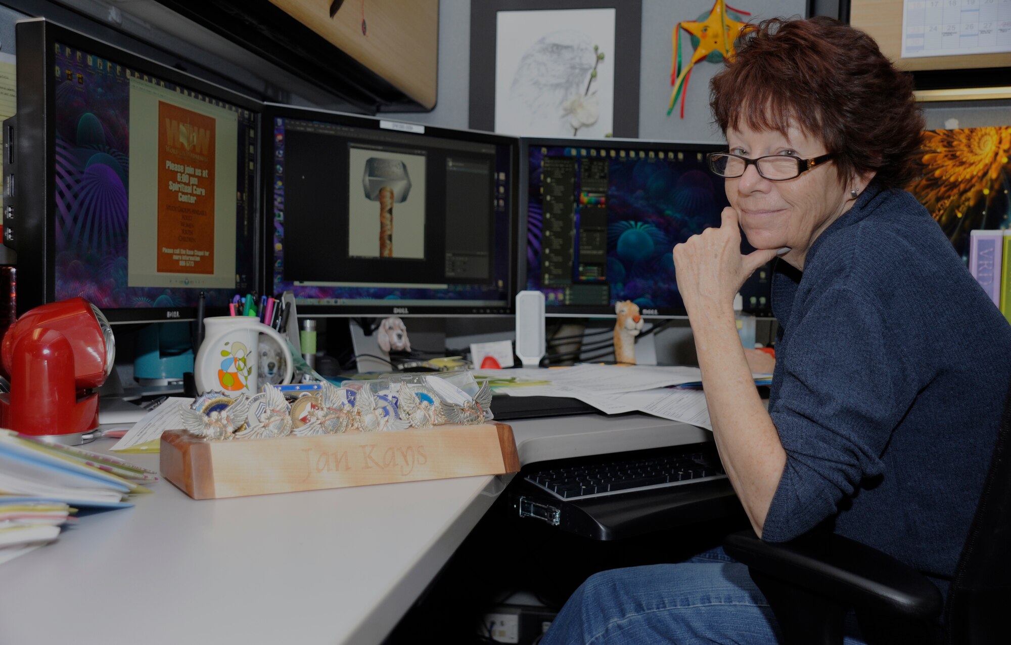 Jan Kays, 30th Space Wing Public Affairs visual information artist, poses in her work environment, Nov. 7, 2014, Vandenberg Air Force Base, Calif. Veterans Day is a nationally celebrated holiday that honors those who have served in the United States Armed Forces. (U.S. Air Force photo by Airman Robert J. Volio/Released)