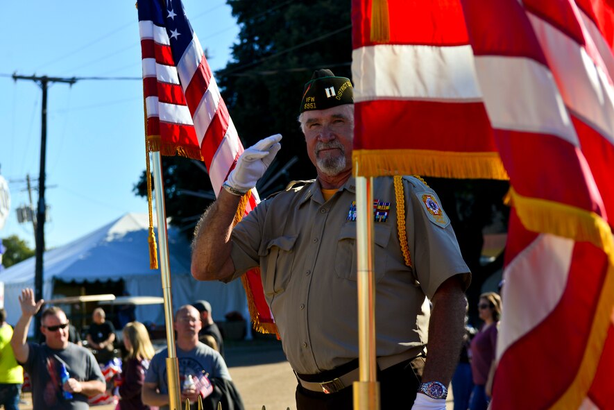 A Veteran salutes spectators during the 2014 Veterans Day parade at Shreveport, La., Nov. 9, 2014. A salute is a gesture used to display respect.  The modern Western salute originated when Knights greeted each other to show friendly intentions by raising their visors to show their faces, using a salute.  (U.S. Air Force photo/Airman 1st Class Mozer Da Cunha)
