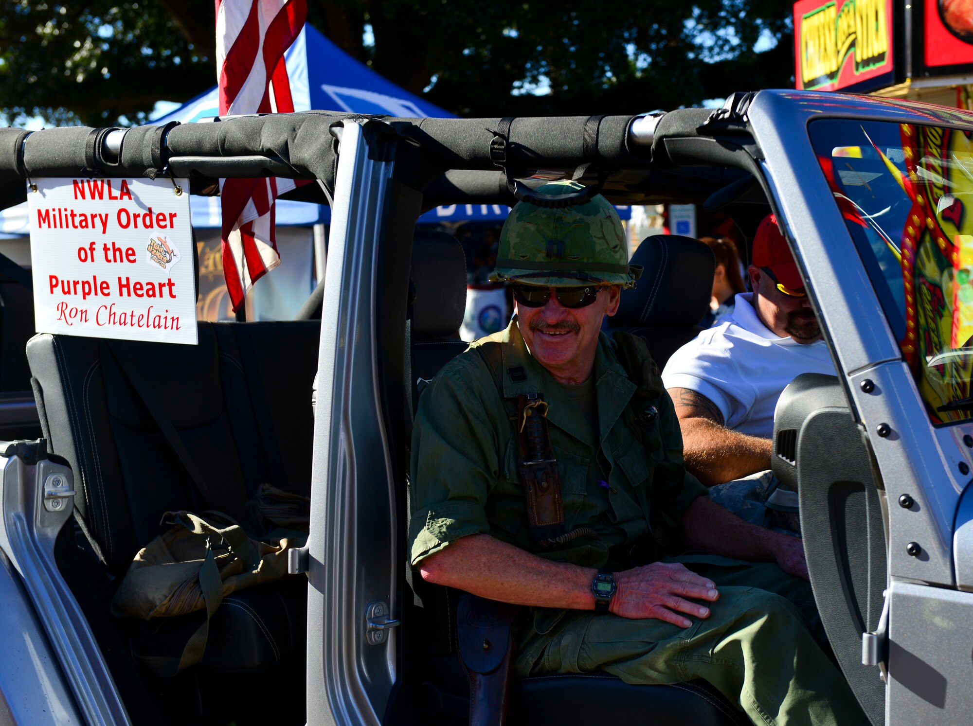 Members with the North West Louisiana Military Order of the Purple Heart drive down the parade grounds during the 2014 Veterans Day parade at Shreveport, La., Nov. 9, 2014. Chartered by Congress in 1958, The Military Order of the Purple Heart is composed of military men and women who have received the Purple Heart for wounds suffered in combat. (U.S. Air Force photo/Airman 1st Class Mozer Da Cunha)
