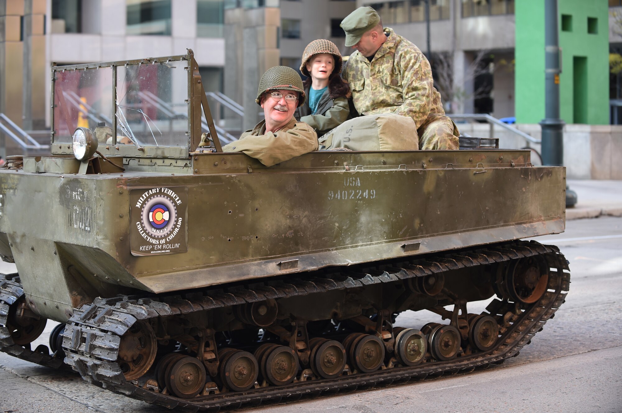 A veteran rides in a classic military vehicle during the Veteran’s Day Parade, hosted by the Colorado Veterans Project, Nov. 8, 2014, in Denver. The parade consisted of more than 75 groups honoring American veterans by highlighting each American war, beginning with the Revolutionary War and ending with Operation Iraqi Freedom. (U.S. Air Force photo by Airman 1st Class Samantha Saulsbury/Released)