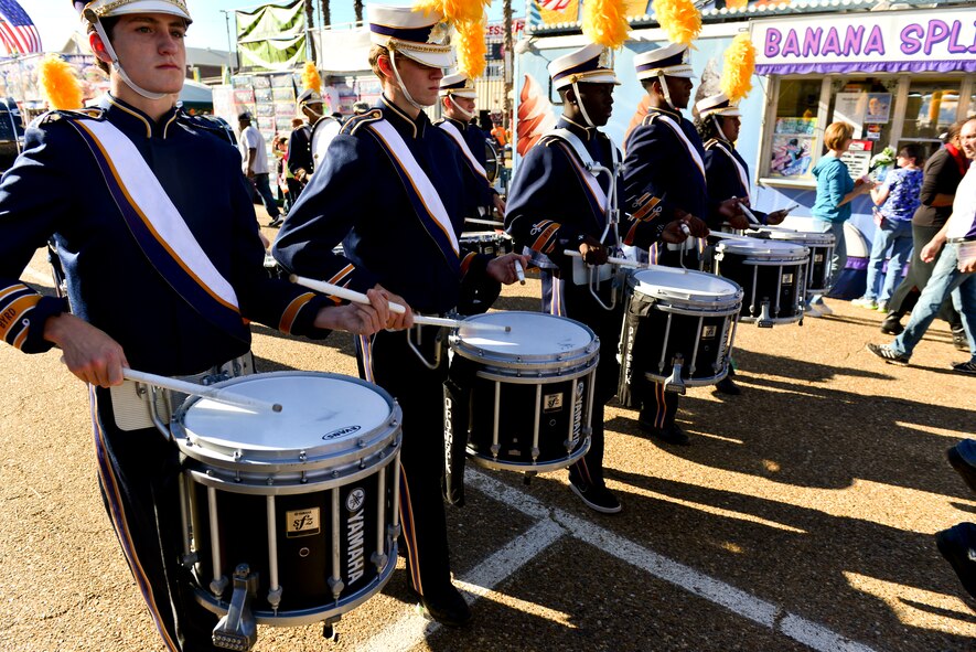 Band members march down the parade ground during the 2014 Veterans Day parade at Shreveport, La., Nov. 9, 2014. The holiday is born from "Armistice Day," established in 1919, to honor the veterans of World War I and to commemorate the end of the war between the Allied Powers and Germany.  (U.S. Air Force photo/Airman 1st Class Mozer Da Cunha)