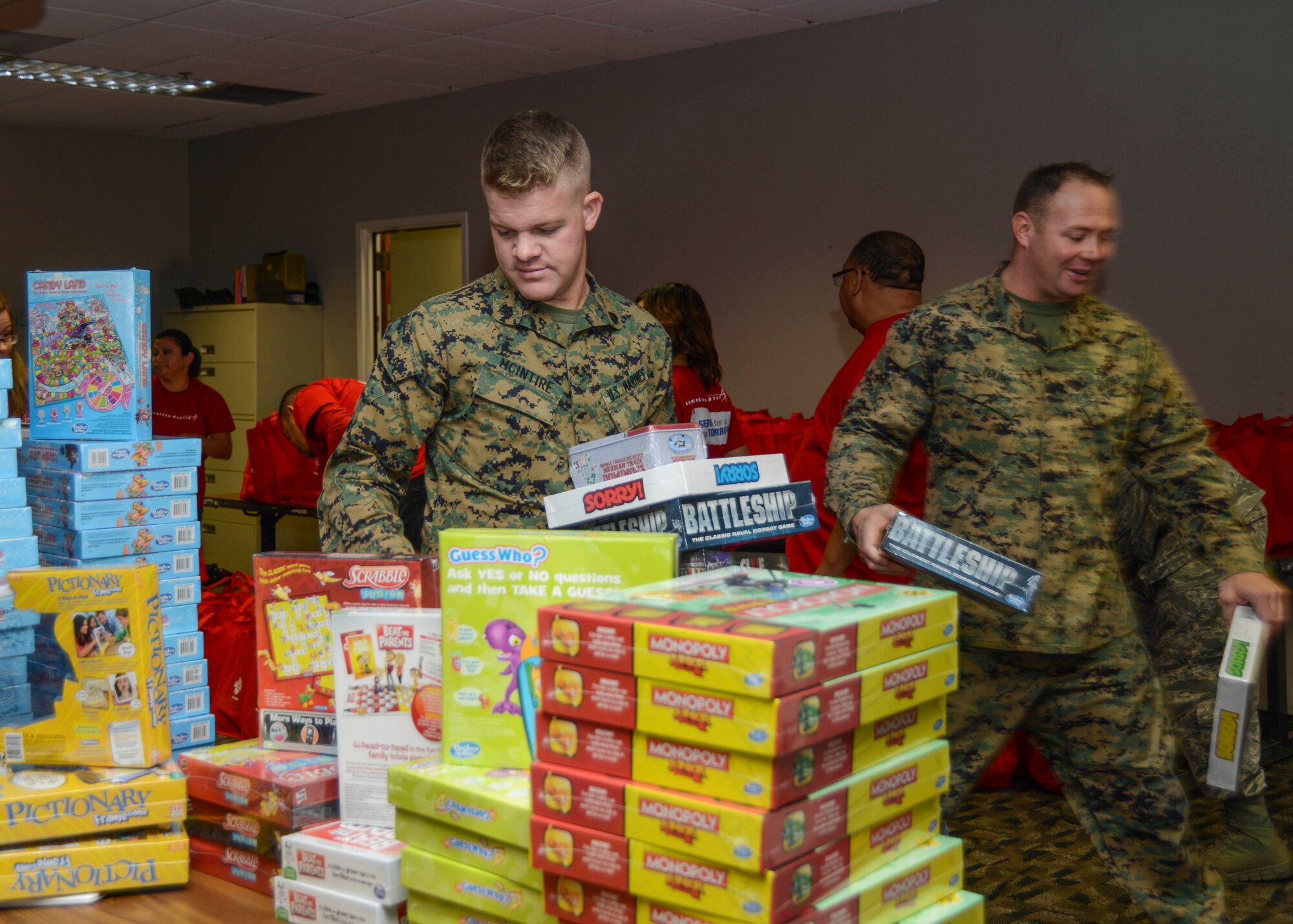 Sgt. Benjamin McIntire and Staff Sgt. Adam Young pick up 27 bags of donations to bring back to their squadron, VMX-22 F-35 Marines. (U.S. Air Force photo by Rebecca Amber)