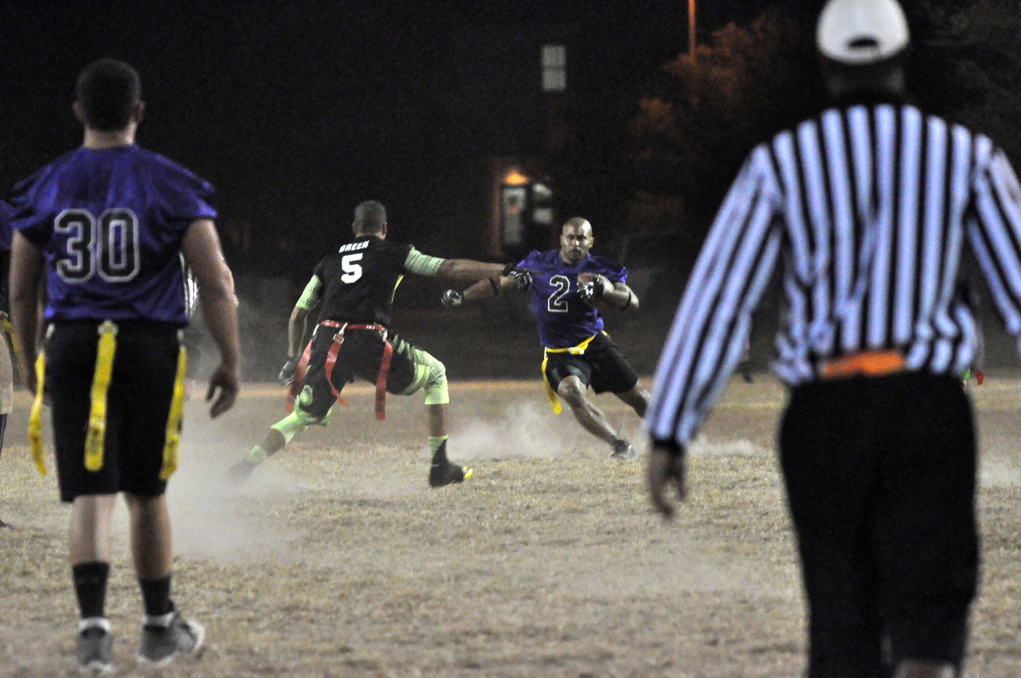 Rodney Watson scrambles to evade Young Gun defender during the Keesler Air Force Base flag football championship game Nov 4. (U.S. Air Force photo by/Master Sgt. Brian Lamar)