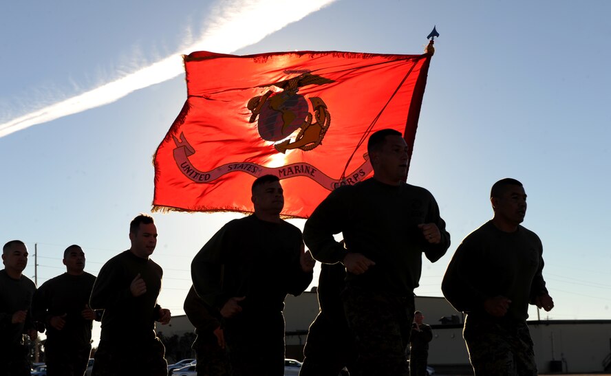 U.S. Marines from Detachment 1, Motor Transport Maintenance Company finish the final mile of their 239 mile Marine Corp birthday run, Nov. 10, 2014, at Dyess Air Force Base, Texas.  The 239 miles were ran over the course of 5 days between 10 marines with the last mile being done in formation. (U.S. Air Force photo by Airman 1st Class Alexander Guerrero/Released)