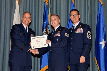 U.S. Air Force members at Joint Base San Antonio receive their Community College of the Air Force degrees Nov. 7, at a ceremony in the Fleenor Auditorium at Joint Base San Antonio-Randolph.  CCAF is federally-chartered degree-granting institution that serves the United States Air Force’s enlisted total force.  (U.S. Air Force photo/Desiree Palacios)