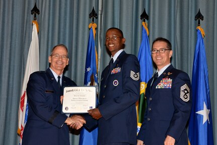 U.S. Air Force members at Joint Base San Antonio receive their Community College of the Air Force degrees Nov. 7, at a ceremony in the Fleenor Auditorium at Joint Base San Antonio-Randolph.  CCAF is federally-chartered degree-granting institution that serves the United States Air Force’s enlisted total force.  (U.S. Air Force photo/Desiree Palacios)