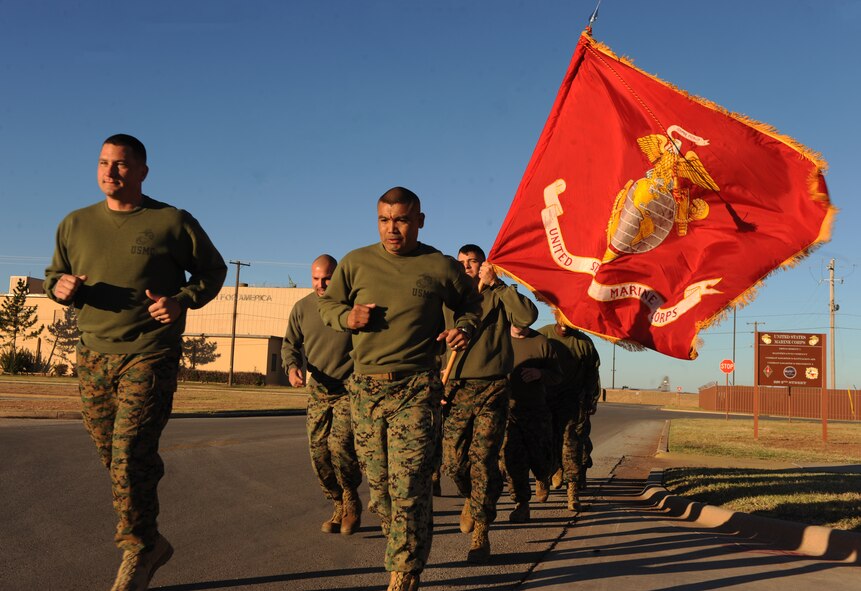 U.S. Marines from Detachment 1, Motor Transport Maintenance Company begin the final mile of their 239 mile tribute to the U.S. Marine Corp Birthday, Nov. 10, 2014, at Dyess Air Force Base, Texas. Ten Marines ran over 20 miles each over a course of five days to reach their goal. (U.S. Air Force photo by Airman 1st Class Alexander Guerrero/Released)