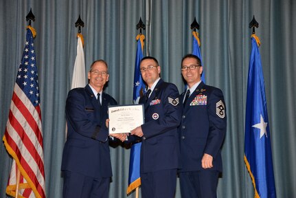 U.S. Air Force members at Joint Base San Antonio receive their Community College of the Air Force degrees Nov. 7, at a ceremony in the Fleenor Auditorium at Joint Base San Antonio-Randolph.  CCAF is federally-chartered degree-granting institution that serves the United States Air Force’s enlisted total force.  (U.S. Air Force photo/Desiree Palacios)