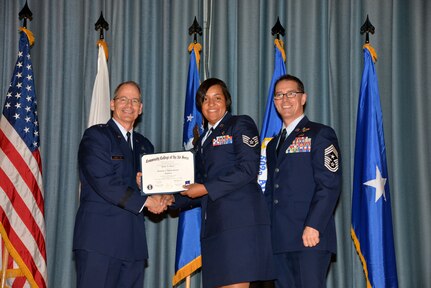 U.S. Air Force members at Joint Base San Antonio receive their Community College of the Air Force degrees Nov. 7, at a ceremony in the Fleenor Auditorium at Joint Base San Antonio-Randolph.  CCAF is federally-chartered degree-granting institution that serves the United States Air Force’s enlisted total force.  (U.S. Air Force photo/Desiree Palacios)