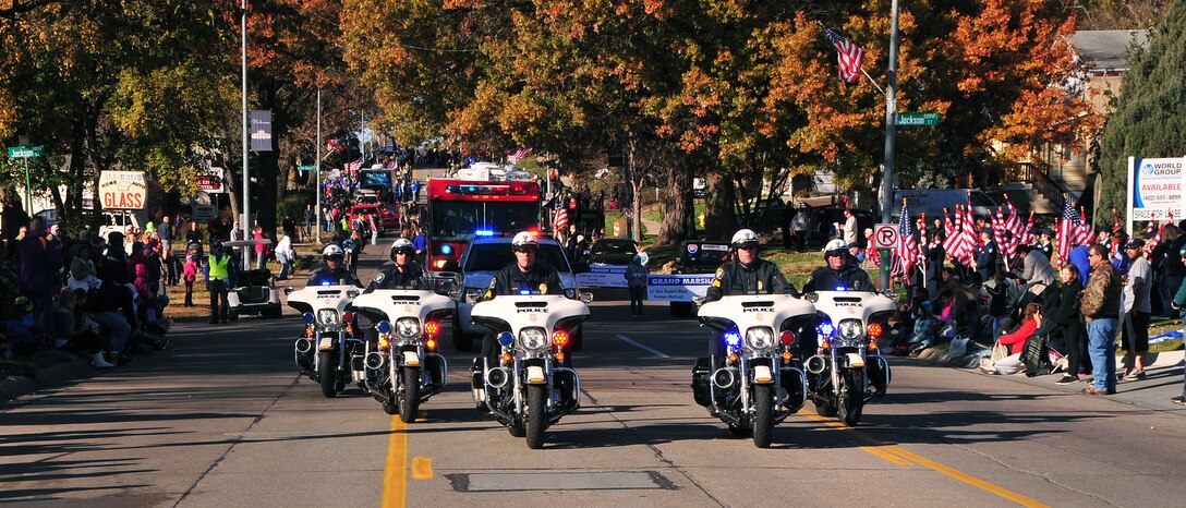 Members of the Bellevue, Nebraska Fire and Police Departments kick off the annual Veterans Day Parade. The parade runs along Mission Avenue in Bellevue and ends with the annual chili/soup feed at Mission Middle School. (U.S. Air Force photo by D.P. Heard/Released)