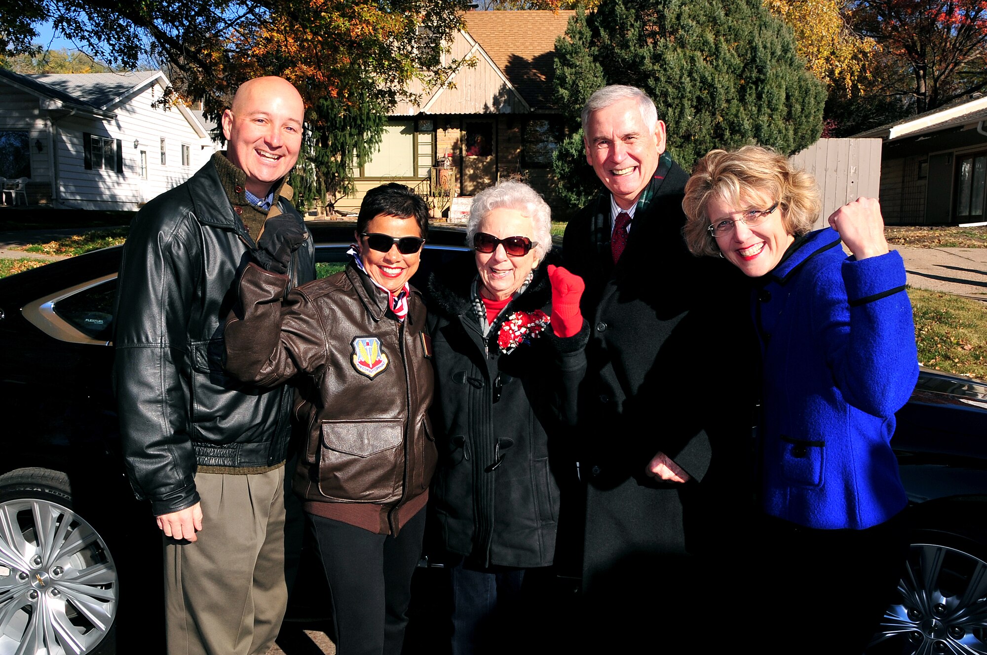 (Left to Right) Nebraska Governor Pete Ricketts, Bellevue Mayor Rita Sanders, Kathryn Shudak, a former "Rosie the Riveter" who worked at the Martin Bomber building on Offutt Air Force Base, Neb. during WWII, Grand Marshal Lt. Gen. (Ret.) Robert Hinson, former Deputy Commander in Chief, U.S. Strategic Command and Air Force Space Command vice commander and Nebraska State Senator Sue Crawford pause for a photo at the annual Veterans Day Parade November 8. (U.S. Air Force photo by D.P. Heard/Released)