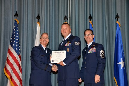 U.S. Air Force members at Joint Base San Antonio receive their Community College of the Air Force degrees Nov. 7, at a ceremony in the Fleenor Auditorium at Joint Base San Antonio-Randolph.  CCAF is federally-chartered degree-granting institution that serves the United States Air Force’s enlisted total force.  (U.S. Air Force photo/Desiree Palacios)