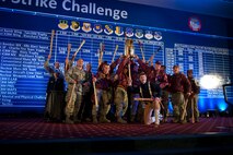 The 91st Missile Wing celebrates after winning the Blackburn Trophy during the Global Strike Challenge score posting event on Barksdale Air Force Base, La., Nov. 5, 2014. The score posting event connects the command's heritage and mission, while at the same time recognizing and celebrating the "best of the best" in technical and weapons system expertise in the bomber, missile and security forces areas. (U.S. Air force photo/Senior Airman Brittany Y. Bateman)