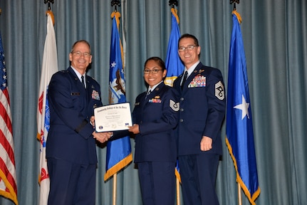 U.S. Air Force members at Joint Base San Antonio receive their Community College of the Air Force degrees Nov. 7, at a ceremony in the Fleenor Auditorium at Joint Base San Antonio-Randolph.  CCAF is federally-chartered degree-granting institution that serves the United States Air Force’s enlisted total force.  (U.S. Air Force photo/Desiree Palacios)