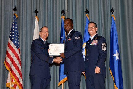 U.S. Air Force members at Joint Base San Antonio receive their Community College of the Air Force degrees Nov. 7, at a ceremony in the Fleenor Auditorium at Joint Base San Antonio-Randolph.  CCAF is federally-chartered degree-granting institution that serves the United States Air Force’s enlisted total force.  (U.S. Air Force photo/Desiree Palacios)
