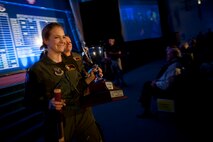The 91st Missile Wing celebrates after winning the MacMahon Trophy during the Global Strike Challenge score posting event on Barksdale Air Force Base, La., Nov. 5, 2014. The score posting event connects the command's heritage and mission, while at the same time recognizing and celebrating the "best of the best" in technical and weapons system expertise in the bomber, missile and security forces areas. (U.S. Air force photo/Senior Airman Brittany Y. Bateman))