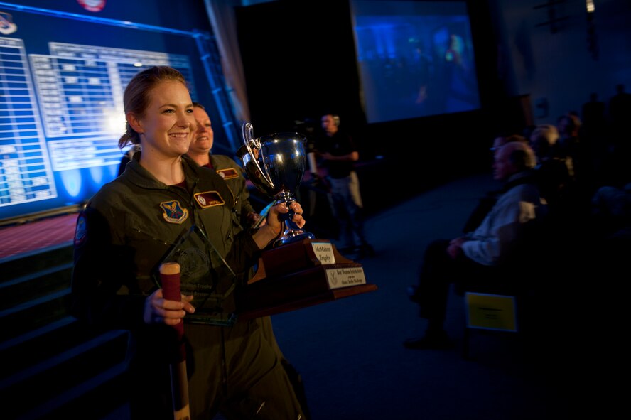 The 91st Missile Wing celebrates after winning the MacMahon Trophy during the Global Strike Challenge score posting event on Barksdale Air Force Base, La., Nov. 5, 2014. The score posting event connects the command's heritage and mission, while at the same time recognizing and celebrating the "best of the best" in technical and weapons system expertise in the bomber, missile and security forces areas. (U.S. Air force photo/Senior Airman Brittany Y. Bateman))