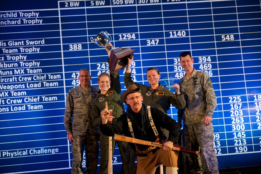 The 91st Missile Wing celebrates after winning the MacMahon Trophy during the Global Strike Challenge score posting event on Barksdale Air Force Base, La., Nov. 5, 2014. The score posting event connects the command's heritage and mission, while at the same time recognizing and celebrating the "best of the best" in technical and weapons system expertise in the bomber, missile and security forces areas. (U.S. Air force photo/Senior Airman Brittany Y. Bateman))